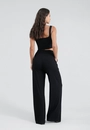 Calça Pantalona Com Bolso E Pregas Em Malha Canelada