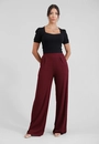 Calça Pantalona Com Bolso E Pregas Em Malha Canelada